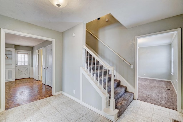 stairs featuring hardwood / wood-style flooring