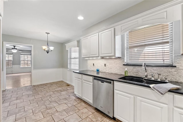 kitchen featuring dishwasher, white cabinets, and a healthy amount of sunlight