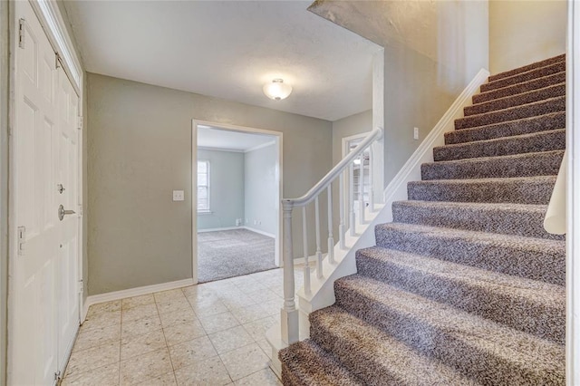 interior space featuring light colored carpet