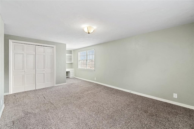 unfurnished bedroom with carpet flooring and a closet