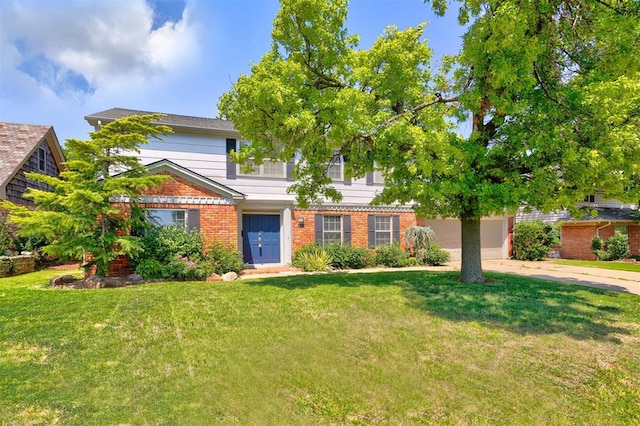 view of front of home with a front yard and a garage