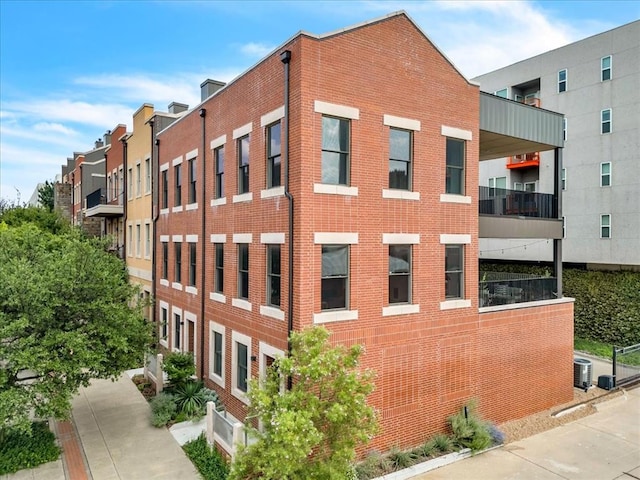 view of building exterior with central AC unit