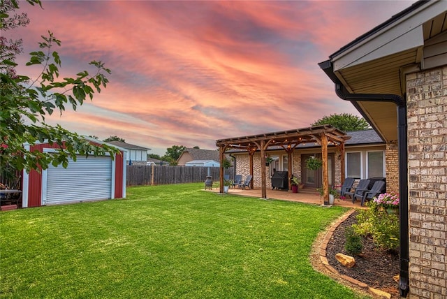 yard at dusk with a pergola, a patio area, and a storage shed