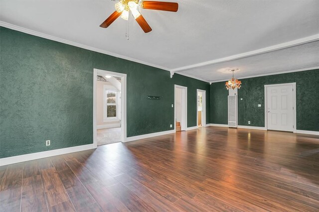 117 W 6th St, Cordell, OK 73632 - unfurnished room featuring crown molding, a chandelier, wood finished floors, ceiling fan, and baseboards