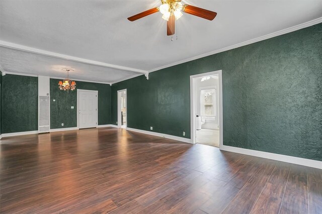 117 W 6th St, Cordell, OK 73632 - spare room featuring a chandelier, wood finished floors, ceiling fan, ornamental molding, and baseboards