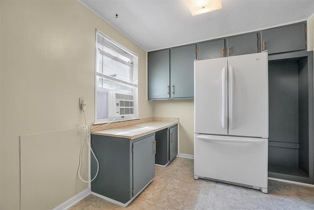 kitchen with white fridge and gray cabinetry