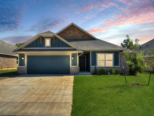 craftsman inspired home with a lawn and a garage