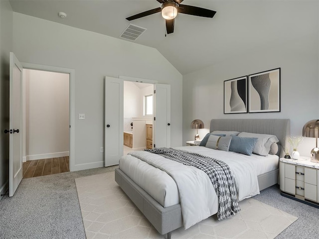 carpeted bedroom featuring connected bathroom, ceiling fan, and lofted ceiling