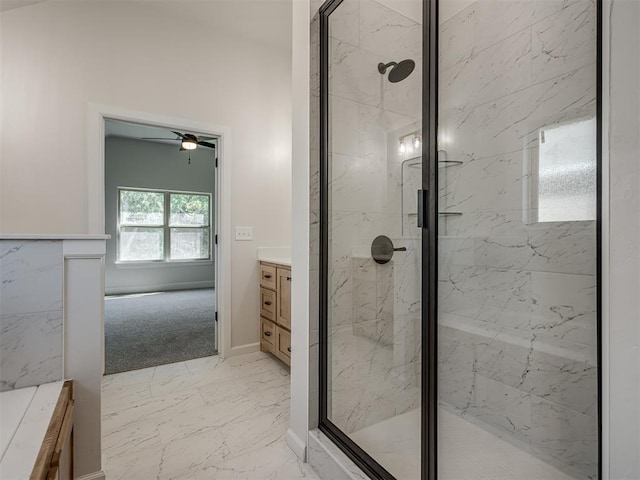 bathroom featuring vanity, ceiling fan, and an enclosed shower