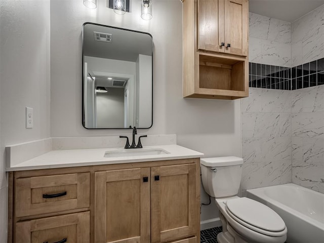 full bathroom featuring vanity, toilet, and tiled shower / bath combo