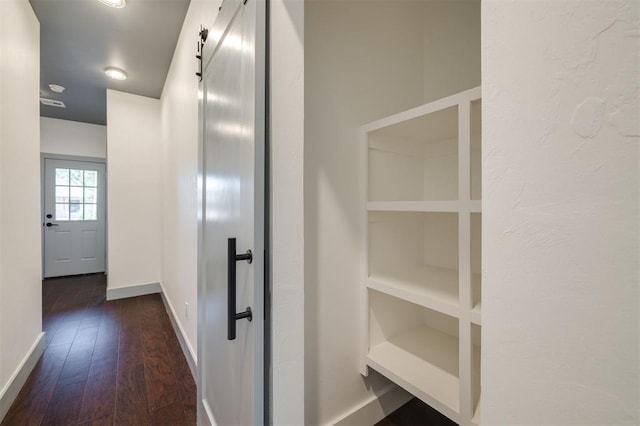 corridor with dark wood-type flooring