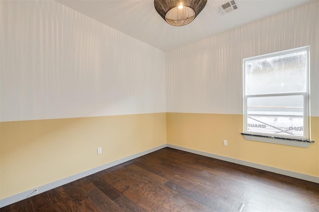 unfurnished room featuring dark hardwood / wood-style floors