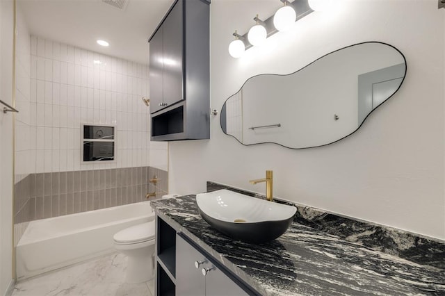 full bathroom featuring vanity, tub / shower combination, and toilet