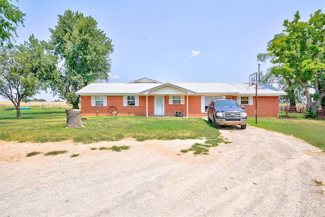 ranch-style house with a front lawn