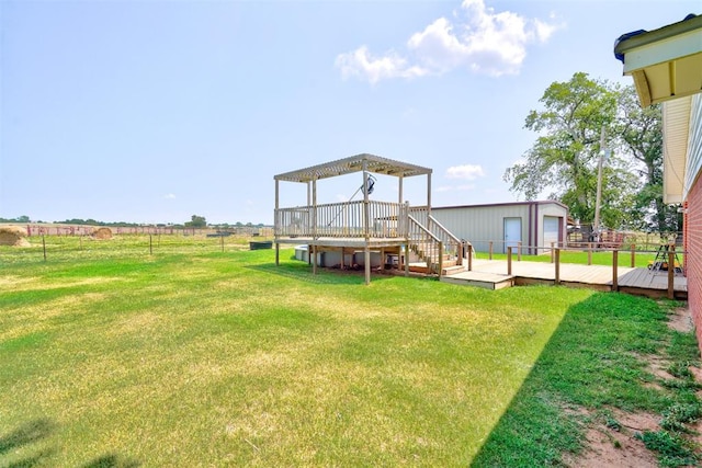 view of yard featuring a rural view and a deck