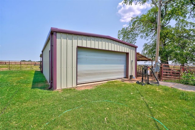 garage featuring a lawn