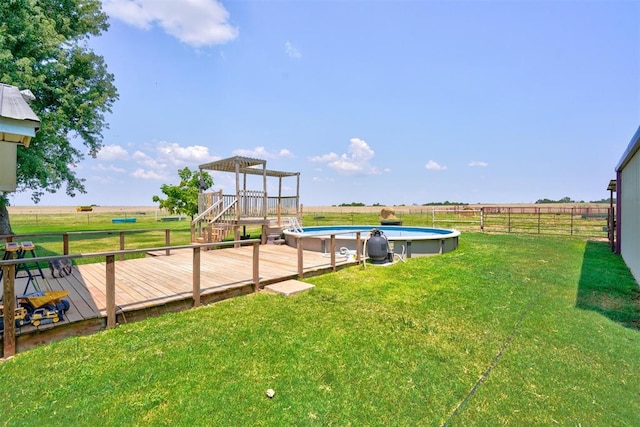 view of yard featuring a rural view and a pool side deck