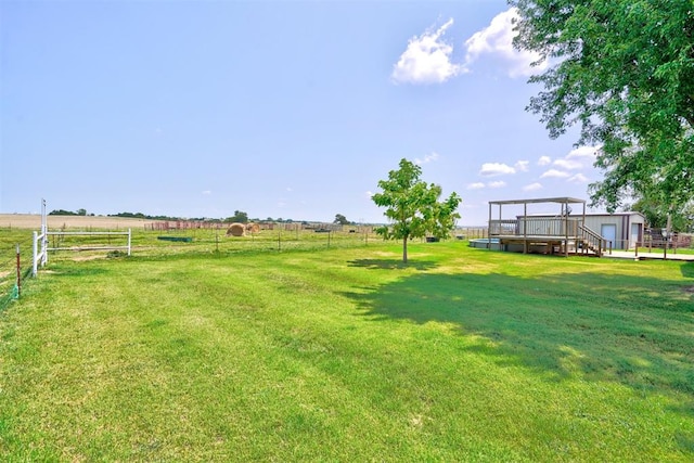 view of yard with a rural view