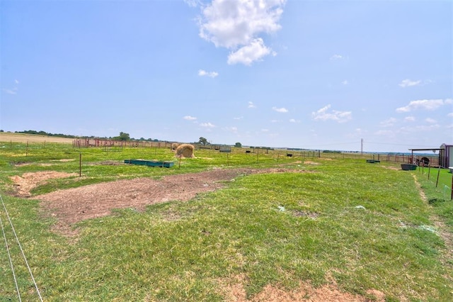 view of yard with a rural view