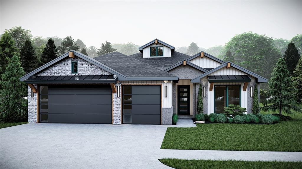 view of front of property featuring a garage and a front lawn