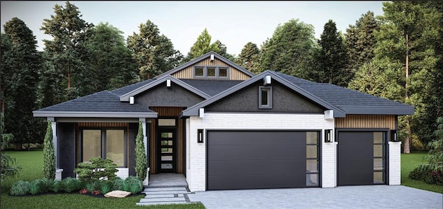 view of front of home with a garage and a front lawn