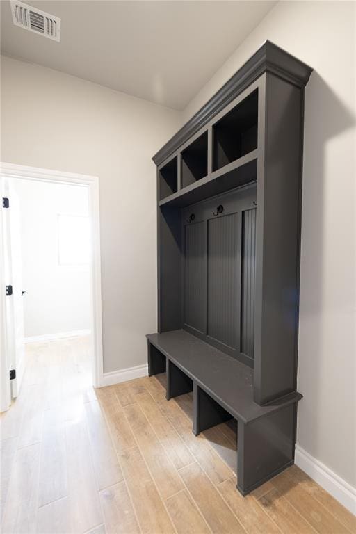 mudroom with light hardwood / wood-style flooring