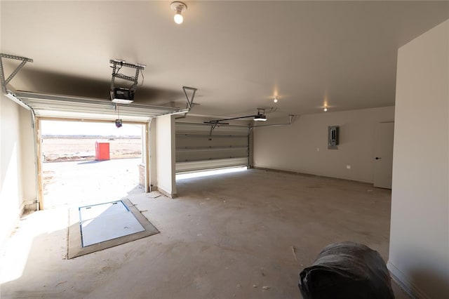 garage with a garage door opener and electric panel