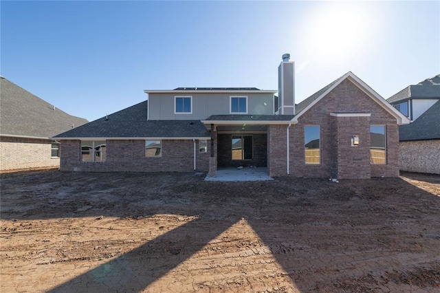 rear view of house featuring a patio area