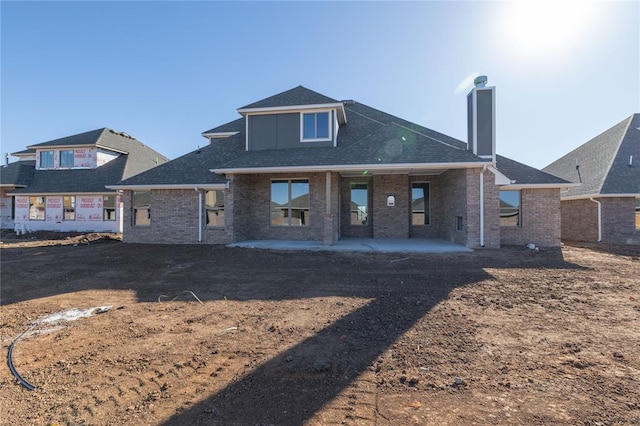 rear view of house featuring a patio