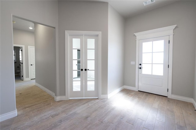 doorway featuring light hardwood / wood-style flooring and french doors