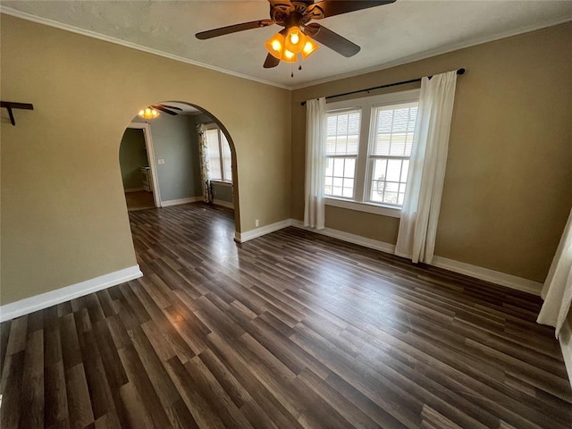 spare room featuring ceiling fan, dark hardwood / wood-style flooring, and ornamental molding