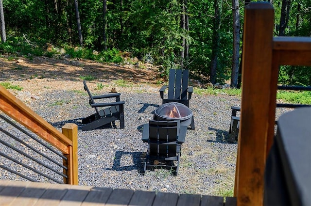 view of yard with a fire pit