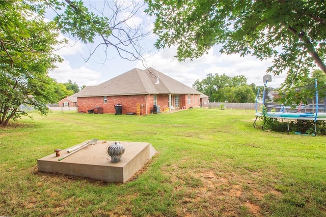 view of yard with a trampoline