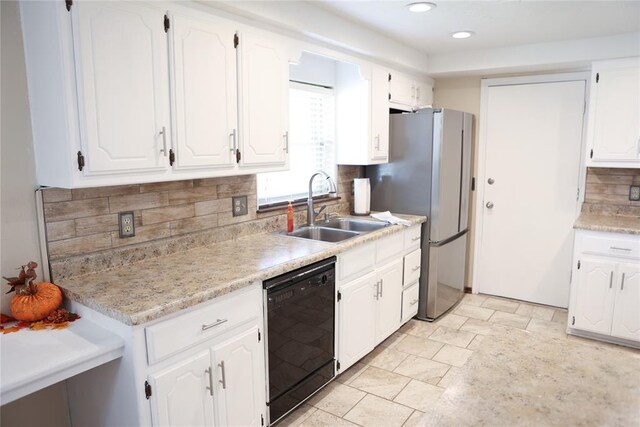 kitchen with tasteful backsplash, dishwasher, white cabinets, and sink