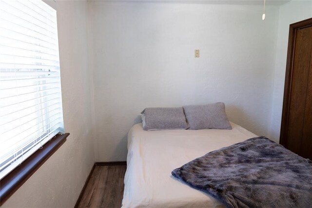 bedroom featuring hardwood / wood-style flooring