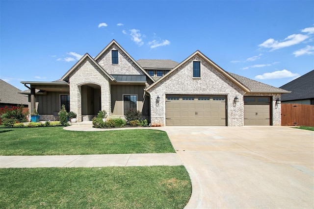 view of front of house featuring a front lawn and a garage