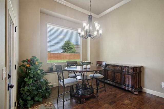 dining area with crown molding, dark hardwood / wood-style flooring, and a notable chandelier