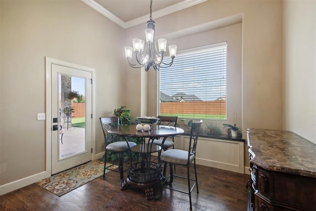 dining room with dark hardwood / wood-style flooring, plenty of natural light, and crown molding