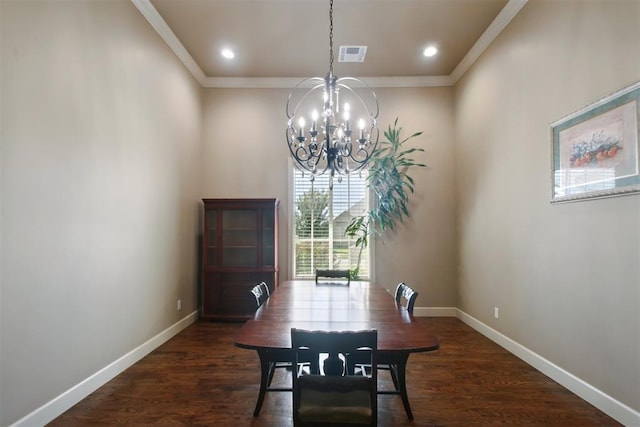 dining area featuring dark hardwood / wood-style flooring, an inviting chandelier, and ornamental molding