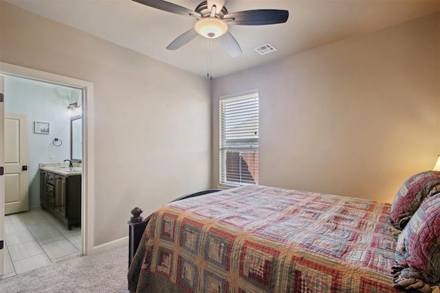 carpeted bedroom featuring ceiling fan, sink, and ensuite bathroom