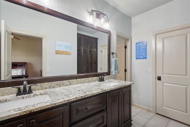 bathroom with tile patterned floors, ceiling fan, and vanity