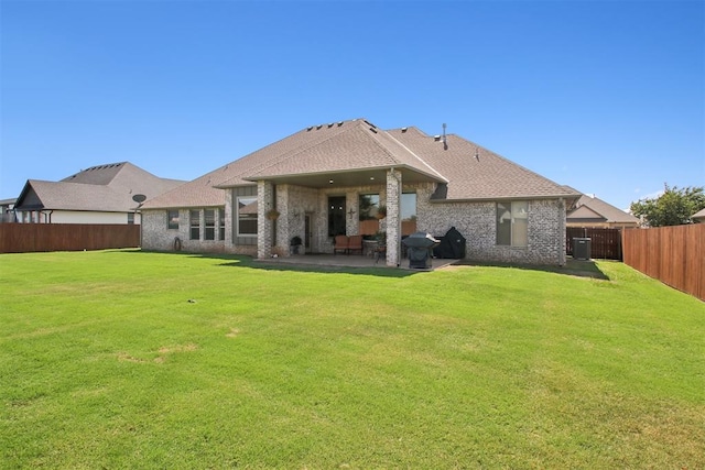 rear view of house featuring a patio, cooling unit, and a lawn