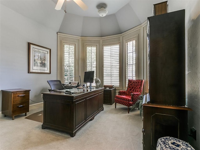 office with ceiling fan, light colored carpet, and lofted ceiling