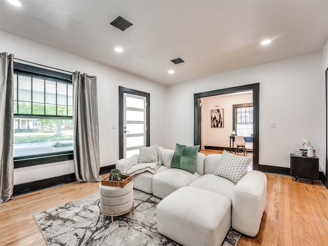 living room with light hardwood / wood-style floors