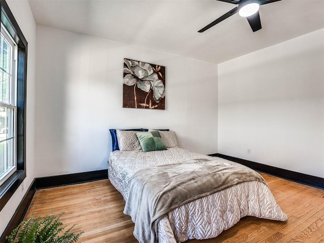 bedroom featuring ceiling fan and wood-type flooring