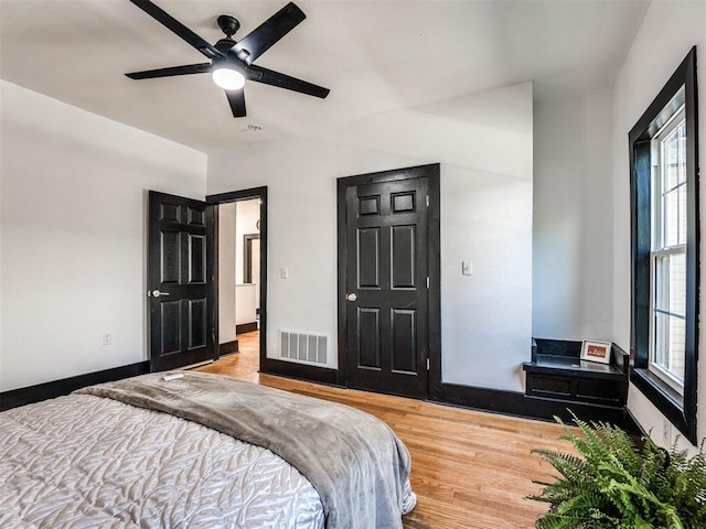 bedroom featuring light hardwood / wood-style floors and ceiling fan