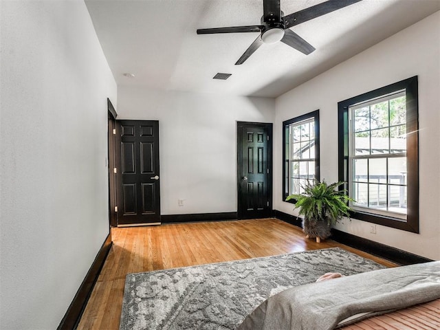 entryway with hardwood / wood-style flooring and ceiling fan