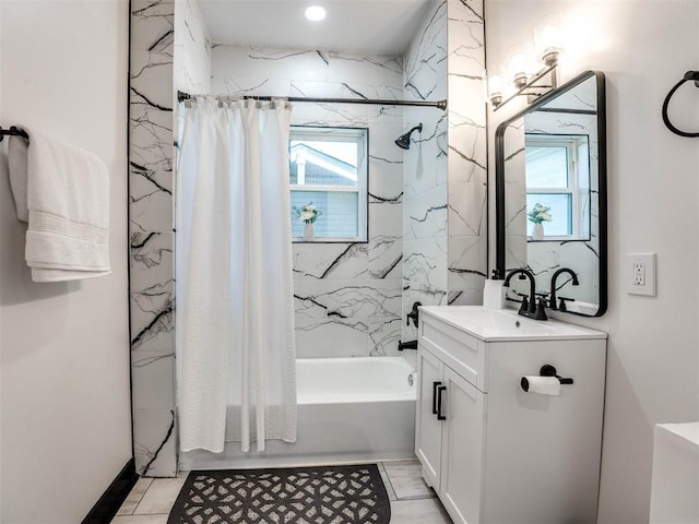 bathroom featuring shower / bath combo with shower curtain and vanity