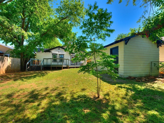 view of yard with a wooden deck