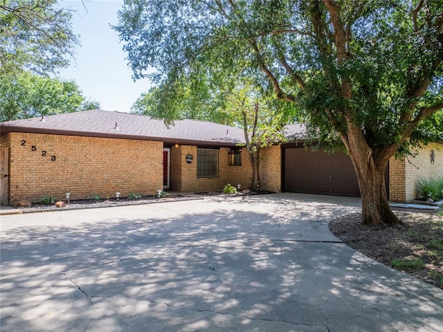 ranch-style house featuring a garage